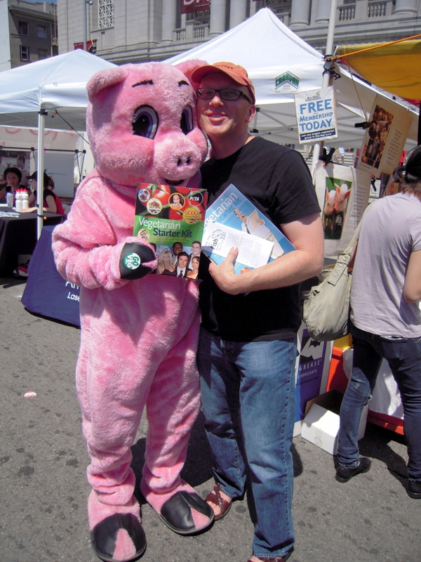 Posing with a rescued hog at SF Gay Pride