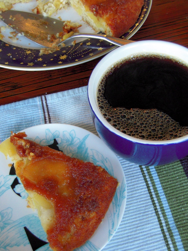 enjoying apple upside down cake with black coffee for breakfast